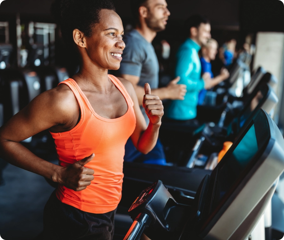 womens-health-related-posts-1 Woman running on treadmill at a gym.
